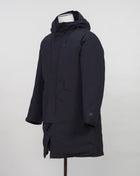 Article: 15CMOW255A 006355A Color: 999 / Black External fabric: 100% Polyester Lining: 100% Polyamide / Nylon Padding (Feather): 90% White duck down, 10% Feather Adjustable hood with logo detail Hidden button and zip fastening Breathable armpit ventilation Taped shoulder seams Storm flap Internal pocket Angular hand pockets Adjustable waist and cuffs Printed logo detail on left sleeve