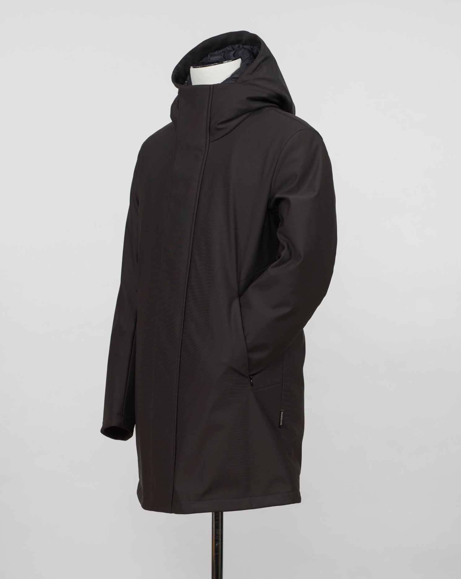Montecore down insulated parka with technical external fabric. Waterproof, breathable, wind stoping. Model: F05MUCX512 Color: 31 / Dark Brown Fabric: 42% pl 36% pa 13% ea 9%pu Lining 100% pa (nylon) 4 zippered pockets in front 4 zippered inside pockets Adjustable hood Zip and snap fasteners closure in front