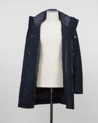 Montecore down insulated parka with technical external fabric. Waterproof, breathable, wind stoping. Model: F05MUCX512 Color: 89 / Navy Fabric: 42% pl 36% pa 13% ea 9%pu Lining 100% pa (nylon) 4 zippered pockets in front 4 zippered inside pockets Adjustable hood Zip and snap fasteners closure in front