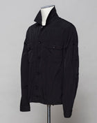 <ul> <li>Button fastening in front</li> <li>2 breast pockets with buttons</li> <li>Small pocket on left arm with snap fastener</li> <li>Embroidered tone-on-tone C.P. Company logo on left pocket</li> <li>Article: 16CMOS106A 005904G</li> <li>Composition: <span data-mce-fragment=