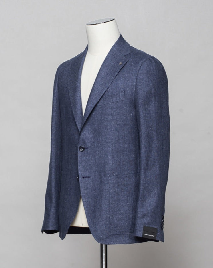 Composition: 60% Linen 40% Virgin Wool. Modello: Monte Carlo / 1SMC22K. Color: Mid Blue / B3146. Unconstructed shoulder. Unlined. 2 Buttons. Notch lapel. Patch pockets. Side vents. Made in Martina Franca, Italy