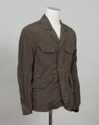CP Blazer Nycra R MBZ250A00 5864G 683 Ivy Green 2 way zip + press studs in front 4 pockets in front with snap stud fastening Zippered pocket on left sleeve with C.P. Lens detailing Garment Dyed Quick Dry Stretch Multi filament