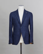 Composition: 58% Virgin Wool 42% Linen Modello: 1SMC22K Article: 470001U Color: I358 Blue Slim fit. Take your normal size Unlined Unconstructed shoulder  2 Buttons Side vents Notch lapel Patch pockets Made in Italy