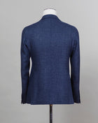 Composition: 58% Virgin Wool 42% Linen Modello: 1SMC22K Article: 470001U Color: I358 Blue Slim fit. Take your normal size Unlined Unconstructed shoulder  2 Buttons Side vents Notch lapel Patch pockets Made in Italy