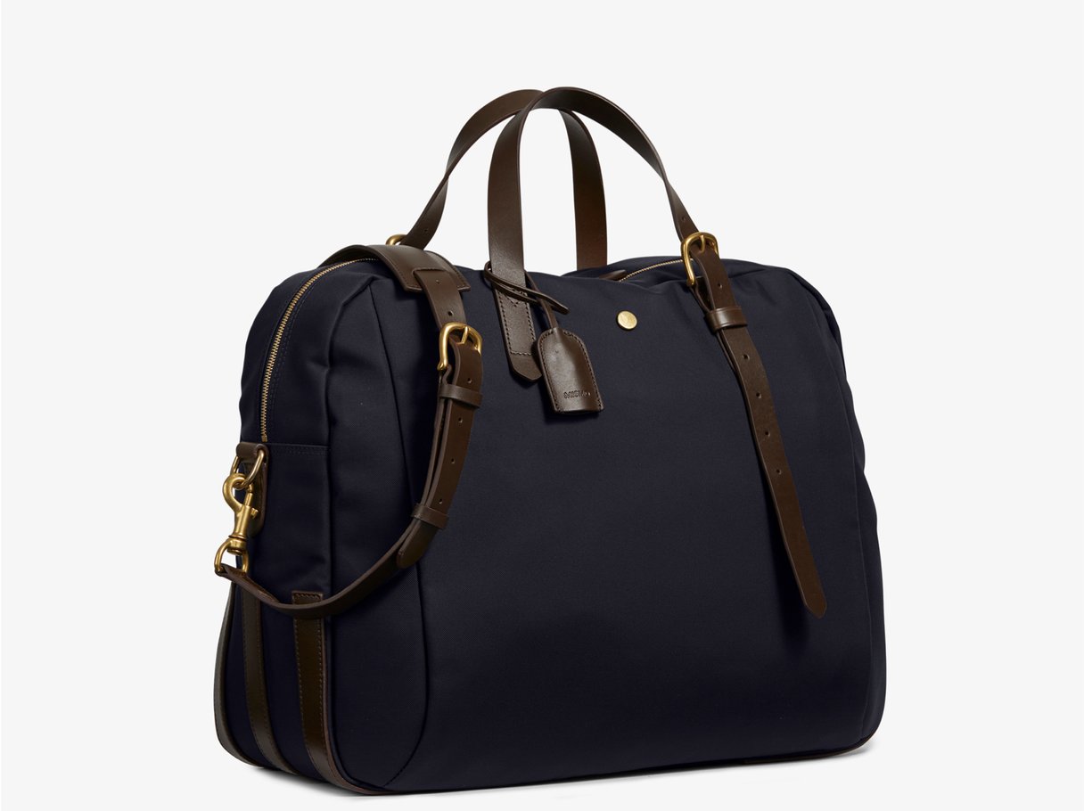 Measurements: L: 47 H: 42 W: 31 (12) cm Body: Waterproof hard woven Italian nylon Fabric composition: PA 42% CO 38% PU 20% / 826 g/m Trimmings: Dark brown custom developed vegetable tanned full-grain bridle leather Lining: 100% cotton in navy colour Hardware: Solid brass with varnish protection Zipper: Hand polished YKK Excella The perfect holdall for the active lifestyle. The M/S Something easily does the job for any trip