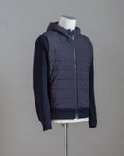 Gran Sasso Rain Wool zippered hoodie with nylon front. Rain wool water-repellent treatment makes this garments water repellent.   Fibres of the garment has been treated with TEFLON™ fabric protector applied by Zegna Baruffa Lane Borgosesia Full Zip closure Removable hood Ribbed hem and cuffs Article: 23177/24613 Colore: 598 / Dark Blue Made in Italy