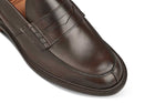 Tricker’s classic step in Penny loafer combines comfort with quiet confidence. In Espresso with Brown storm welt, leather uppers and linings for even greater refinement, channelled and stitched leather sole. Tricker's James Penny Loafer / Espresso