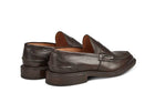 Tricker’s classic step in Penny loafer combines comfort with quiet confidence. In Espresso with Brown storm welt, leather uppers and linings for even greater refinement, channelled and stitched leather sole. Tricker's James Penny Loafer / Espresso
