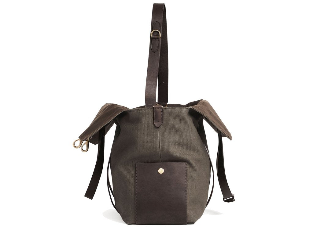 Measurements: L: 46 H: 34 W:18 cm Body: Tight-woven cotton canvas Fabric composition: CO 94% PU 4% PC 2% - 709 gr/rm Trimmings: Dark brown vegetable tanned full-grain bridle leather Lining: 100% cotton in Army colour Hardware: Solid brass with varnish protection Zipper: Hand Polished YKK Excella Art. No. MS110110 travel bag, or bend flaps down for a large, open city tote bag. A full-grain leather pocket on each gusset adds extra durability to the bottom corners