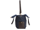 Measurements: L: 46 H: 34 W:18 cm Body: Waterproof hard woven Italian nylon Fabric Composition: PA 42% CO 38% PU 20% / 826g pr. meter Trimmings: Dark brown vegetable tanned full-grain bridle leather Lining: 100% cotton in Navy colour Hardware: Solid brass with varnish protection Zipper: Hand polished YKK Excella Art. No. MS111312 travel bag, or bend flaps down for a large, open city tote bag. A full-grain leather pocket on each gusset adds extra durability to the bottom corners