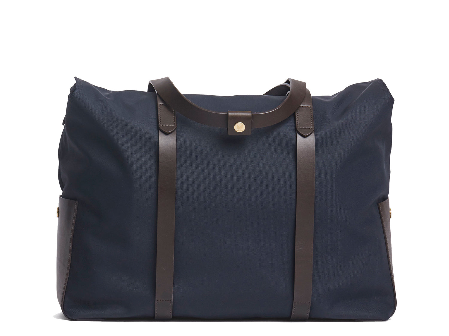 Measurements: L: 46 H: 34 W:18 cm Body: Waterproof hard woven Italian nylon Fabric Composition: PA 42% CO 38% PU 20% / 826g pr. meter Trimmings: Dark brown vegetable tanned full-grain bridle leather Lining: 100% cotton in Navy colour Hardware: Solid brass with varnish protection Zipper: Hand polished YKK Excella Art. No. MS111312 travel bag, or bend flaps down for a large, open city tote bag. A full-grain leather pocket on each gusset adds extra durability to the bottom corners