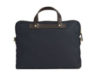 Measurements: L: 39 H: 29 W: 8cm Body: Waterproof hard woven Italian nylon Fabric composition: PA 42% CO 38% PU 20% / 826g pr/m Trimmings: Dark brown custom developed vegetable tanned full-grain bridle leather Lining: 100% cotton in navy colour Hardware: Solid brass with varnish protection Zipper: Hand polished YKK Excella Art. No. MS461315 A softer and more casual counterpart to the M/S Briefcase, the M/S Office is designed with dual front pockets that zip open into one large compartment