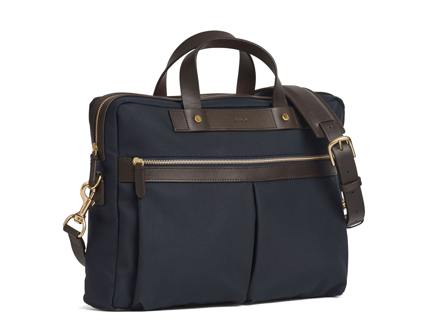 Measurements: L: 39 H: 29 W: 8cm Body: Waterproof hard woven Italian nylon Fabric composition: PA 42% CO 38% PU 20% / 826g pr/m Trimmings: Dark brown custom developed vegetable tanned full-grain bridle leather Lining: 100% cotton in navy colour Hardware: Solid brass with varnish protection Zipper: Hand polished YKK Excella Art. No. MS461315 A softer and more casual counterpart to the M/S Briefcase, the M/S Office is designed with dual front pockets that zip open into one large compartment