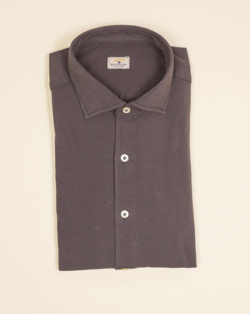 Jersey shirts are very comfortable and this shirt makes no exemption. It looks like dress shirt and feels like knitwear. We think this kind of garments represent modern tailoring very well. They honor classic styles and lines, but they are made to be super comfortable and practical. 100% cotton Semi cutaway collar Single cuffs Removable collar bones Model. TJ08/IN Article. J119 Color. 126 / Mid Brown