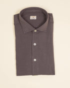 Jersey shirts are very comfortable and this shirt makes no exemption. It looks like dress shirt and feels like knitwear. We think this kind of garments represent modern tailoring very well. They honor classic styles and lines, but they are made to be super comfortable and practical.   100% cotton Semi cutaway collar Single cuffs Removable collar bones Model. TJ08/IN Article. J119 Color. 126 / Mid Brown