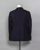 Tagliatore tuxedo with shawl collar. Unconstructed shoulder and half lined inside construction on jacket. Flat front trousers with satin waistband, matching to jacket lapel. Composition: 99% Virgin Wool Super 110's 1% Elastan Stretch Modello: S-PL18A01 LIS Color: Navy / B270 Unconstructed Unlined 1 button Shawl collar Jet pockets Back vent Flat front Made in Martina Franca, Italy