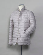 In-Tech™ Alternative Down Light insulation Water repellent Breathable External layer 100% Polyamide Internal padding 100% Polyester Light insulation Buttons and Zip fastening in front Notch lapel Straight flap pockets Center vent PC002ULE 19288 Color: 1300 Made in Romania Herno In-Tech™ Alternative Down jacket. Very versatile outerwear piece that works just as good on both spring and fall or when ever it is a bit chilly.