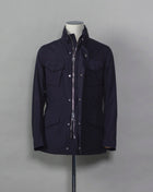 Montecore waterproof field jacket. Four pockets in front and adjustable waistband. Adjustable hood that can be folded inside the collar. So all the classical elements of a proper field jacket plus the added value of a waterproof and breathable technical  material. Four pockets in front Adjustable waist band Adjustable hood inside the collar Waterproof Breathable Taped seams  79% Polyester 21% Polyurethane Art. S04MUCT603 Col. 89 / Navy