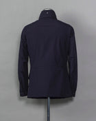 Montecore waterproof field jacket. Four pockets in front and adjustable waistband. Adjustable hood that can be folded inside the collar. So all the classical elements of a proper field jacket plus the added value of a waterproof and breathable technical  material. Four pockets in front Adjustable waist band Adjustable hood inside the collar Waterproof Breathable Taped seams  79% Polyester 21% Polyurethane Art. S04MUCT603 Col. 89 / Navy