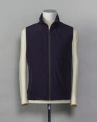 Montecore light down vest. Four zippered pockets outside and 2 inside. Light weight hood folded inside the collar. Article: S04MUWX725 Fabric: Solotex® 100% Polyester Lining: 100% Polyamide Filling: 90% Down 10% Feathers Color: 89 / Navy