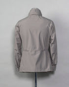 Montecore waterproof field jacket. Four pockets in front and adjustable waistband. Adjustable hood that can be folded inside the collar. So all the classical elements of a proper field jacket plus the added value of a waterproof and breathable technical  material. Four pockets in front Adjustable waist band Adjustable hood inside the collar Waterproof Breathable Taped seams 79% Polyester 21% Polyurethane Art. S04MUCT603 Col. 23 / Stone Grey