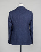 Tagliatore linen/wool blazer. Model Montecarlo, which is familiar to most of our regular customers. Slim fit with light unconstructed make. Comfortable to wear and easy to combine with almost anything. If in doubt of your size, please contact us HERE. Composition: 60% Linen 40% Virgin wool Modello: Monte Carlo / 1SMC22K Color: Blue / B3121 Unconstructed Unlined 2 Buttons Notch lapel Patch pockets Side vents Made in Martina Franca, Italy