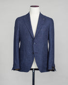 Tagliatore linen/wool blazer. Model Montecarlo, which is familiar to most of our regular customers. Slim fit with light unconstructed make. Comfortable to wear and easy to combine with almost anything. If in doubt of your size, please contact us HERE. Composition: 60% Linen 40% Virgin wool Modello: Monte Carlo / 1SMC22K Color: Blue / B3121 Unconstructed Unlined 2 Buttons Notch lapel Patch pockets Side vents Made in Martina Franca, Italy