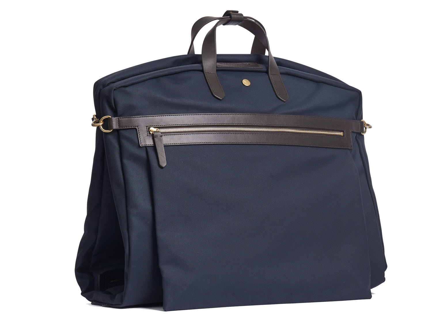 Measurements: L: 52 x W: 50 x H: 7 cm Body: Waterproof hard woven Italian nylon Fabric composition: PA 42% CO 38% PU 20% / 826g /m Trimmings: Dark brown custom developed vegetable tanned full-grain bridle leather Lining: 100% cotton in navy colour Hardware: Solid brass with varnish protection Zipper: Hand polished YKK Excella Art. No. MS441315 Transporting your work, wedding, and/or weekend wear just got a whole lot easier. Slip garments into first ever full size garment bag large to carry all mismo