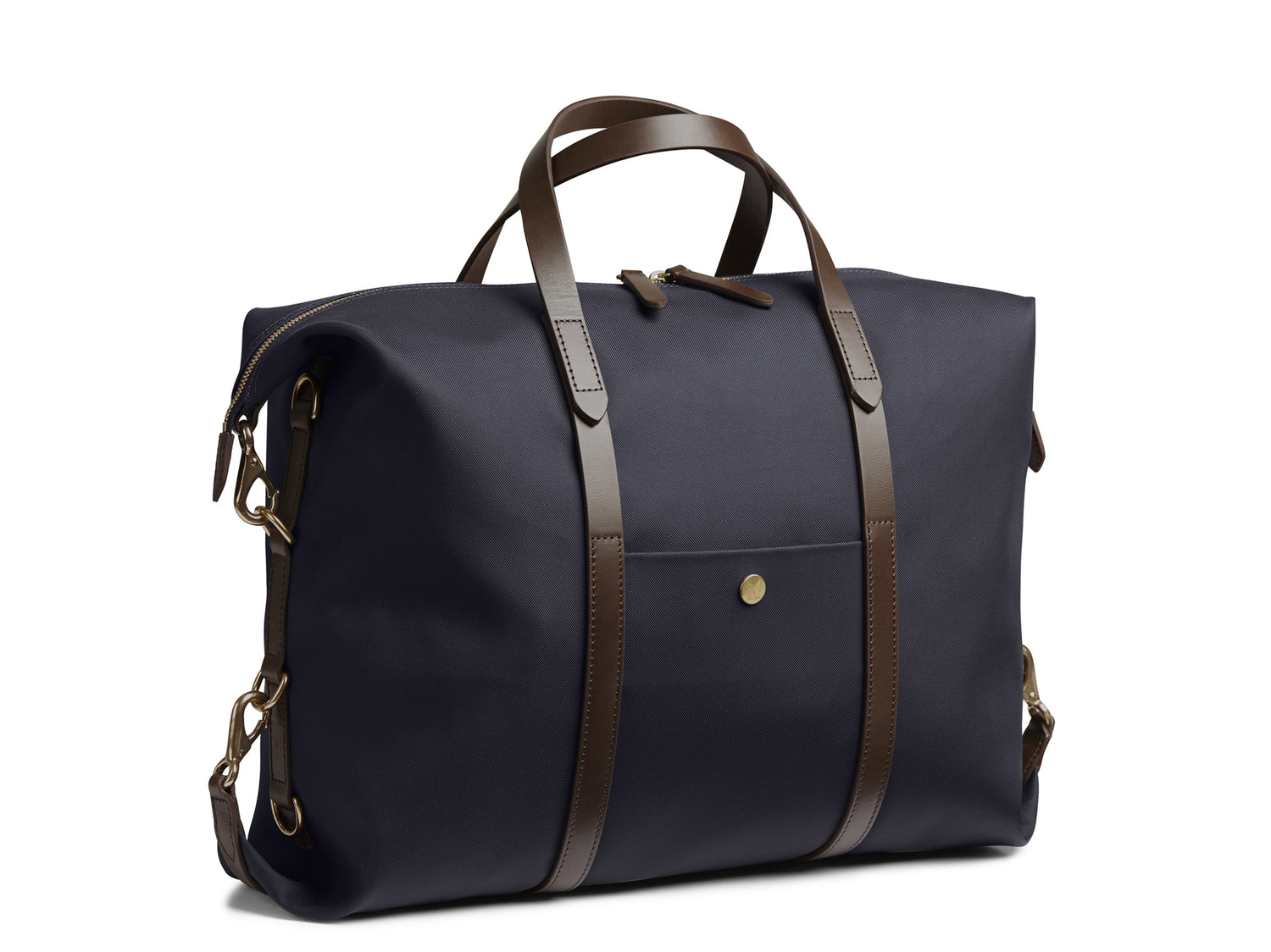 Measurements: L: 42(52) H: 31(41) W: 12(4) cm Body: Waterproof hard woven Italian nylon Fabric composition: PA 42% CO 38% PU 20% / 826g /m Trimmings: Dark brown custom developed vegetable tanned full-grain bridle leather Lining: 100% cotton in army colour Hardware: Solid brass with varnish protection Zipper: Hand polished YKK Excella Art. No. MS121312 A flexible duffle/work bag that can be adjusted in size by attaching the snap hooks in each corner of the bag to the brass D-rings on the gusset