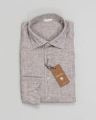 This shirt is made of linen and is detailed with mother of pearl buttons, single cuffs and a cut away collar.

Composition: 100% Linen
Article: 7747217970
Color: 250 / Light Brown
Slimline