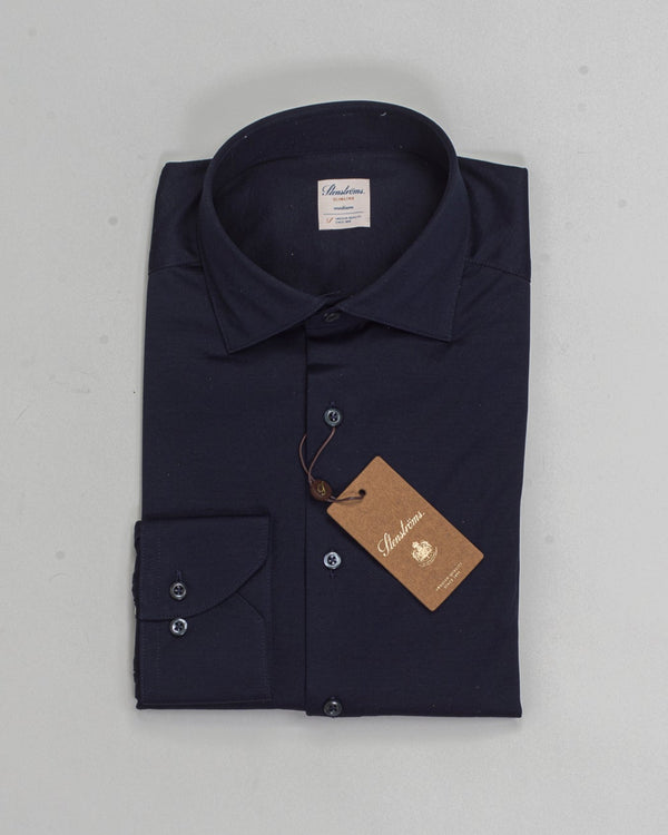 This navy casual Slimline jersey shirt is made of cotton. The shirt is detailed with mother of pearl buttons, single cuffs and a cut away collar.

Composition: 100% Cotton
Article: 8407118270
Color: 190 / Navy
Slimline