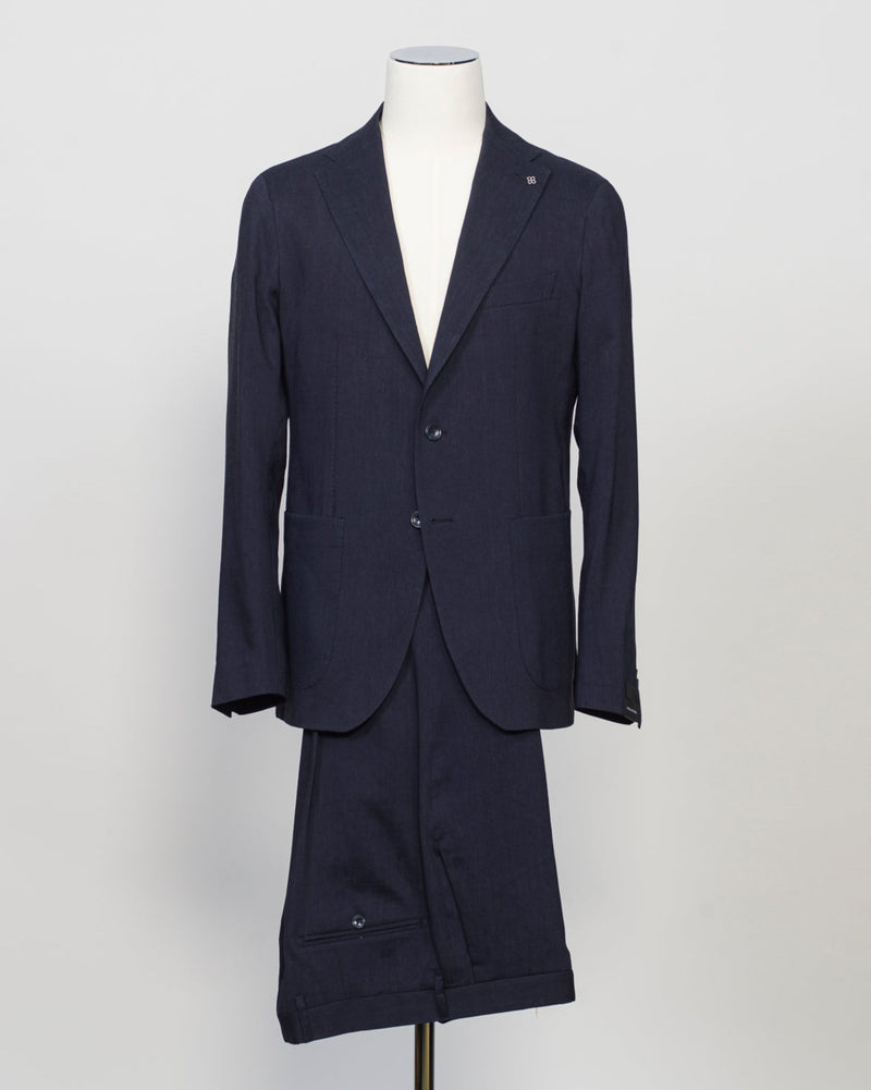 Composition: 53% Linen 39% Virgin wool 8% Mohair
Modello: Monte Carlo / 2SMC22K01
Color: Navy / B3075
Unconstructed shoulder
Unlined
2 Buttons
Notch lapel
Patch pockets
Side vents
Flat front trousers
Belt loops
Slanted side pockets
2 back pockets
Made in Martina Franca, Italy Tagliatore Linen Wool &amp; Mohair Suit / Navy
