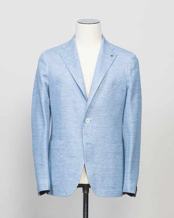 Tagliatore jacket made from a textured cotton &amp; linen naturally stretching fabric. Comfort of a knit in a form of a jacket.&nbsp;Extremely versatile jacket for soft tailored look. Unconstructed shoulder and unlined structure.
59% Linen 41% Cotton
Naturally stretching
Modello: 1SMJ22K
Article: 570003J
Color: Light Blue / I1219
Notch Lapel
Patch Pockets
Unlined
Made in Italy Tagliatore Linen &amp; Cotton Jacket / Light Blue