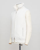 Fisherman's rib 3-ply pure cashmere sleeveless jacket. The metal zippers add a modern, functional touch. The faux fur lining provides warmth and comfort, making it ideal for colder days. The side pockets complete the stylish and practical design.

Outer composition: 100% cashmere
Inner composition: 100% Faux fur
Zipped side pockets
Two-way zipper
Art 23144 15581
Col 001 Cream White
Regular fit
Made in Italy Gran Sasso Eco-Fur & Cashmere Ribbed Vest / White