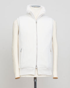 Fisherman's rib 3-ply pure cashmere sleeveless jacket. The metal zippers add a modern, functional touch. The faux fur lining provides warmth and comfort, making it ideal for colder days. The side pockets complete the stylish and practical design.

Outer composition: 100% cashmere
Inner composition: 100% Faux fur
Zipped side pockets
Two-way zipper
Art 23144 15581
Col 001 Cream White
Regular fit
Made in Italy Gran Sasso Eco-Fur &amp; Cashmere Ribbed Vest / White