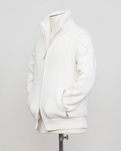 Fisherman's rib 3-ply pure cashmere sleeveless jacket. The metal zippers add a modern, functional touch. The faux fur lining provides warmth and comfort, making it ideal for colder days. The side pockets complete the stylish and practical design.

Outer composition: 100% cashmere
Inner composition: 100% Faux fur
Zipped side pockets
Two-way zipper
Art 23144 15581
Col 001 Cream White
Regular fit
Made in Italy Gran Sasso Eco-Fur &amp; Cashmere Ribbed Vest / White
