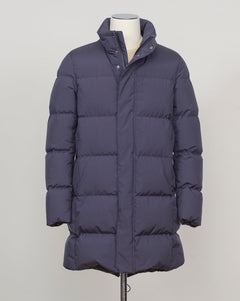 Italian craftsmanship meets alpine performance. This Herno down coat combines waterproof technical fabrics with precisely tailored construction, delivering luxury warmth for demanding seasons. Navy works across formal and casual contexts. Herno Waterproof Down Coat / Navy