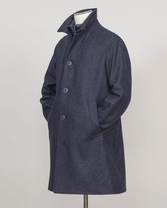 Iconic Herno wool coat in refined glencheck, balancing navy and blue for understated luxury. Fully lined for structured layering across seasons. Features a detachable bib for versatile styling—wear it integrated for classic formality or remove for a streamlined silhouette. Italian craftsmanship and meticulous tailoring define this essential investment piece. Herno Lined Glencheck Wool Coat / Navy &amp; Blue