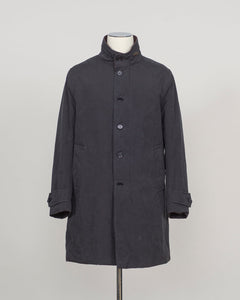 A dark charcoal gray mid-length coat with a high stand collar and front buttons, displayed on a mannequin torso against a light gray studio background.