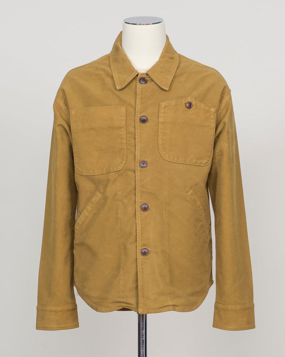 Structured overshirt tailored for layering over knitwear or worn standalone. Durable Italian moleskin fabric with subtle texture and natural drape. Versatile piece for refined casual and smart-casual wardrobes. Tela Genova Moleskin Overshirt / Mustard