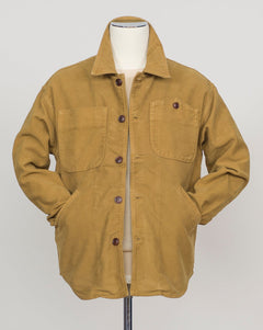 Structured overshirt tailored for layering over knitwear or worn standalone. Durable Italian moleskin fabric with subtle texture and natural drape. Versatile piece for refined casual and smart-casual wardrobes. Tela Genova Moleskin Overshirt / Mustard