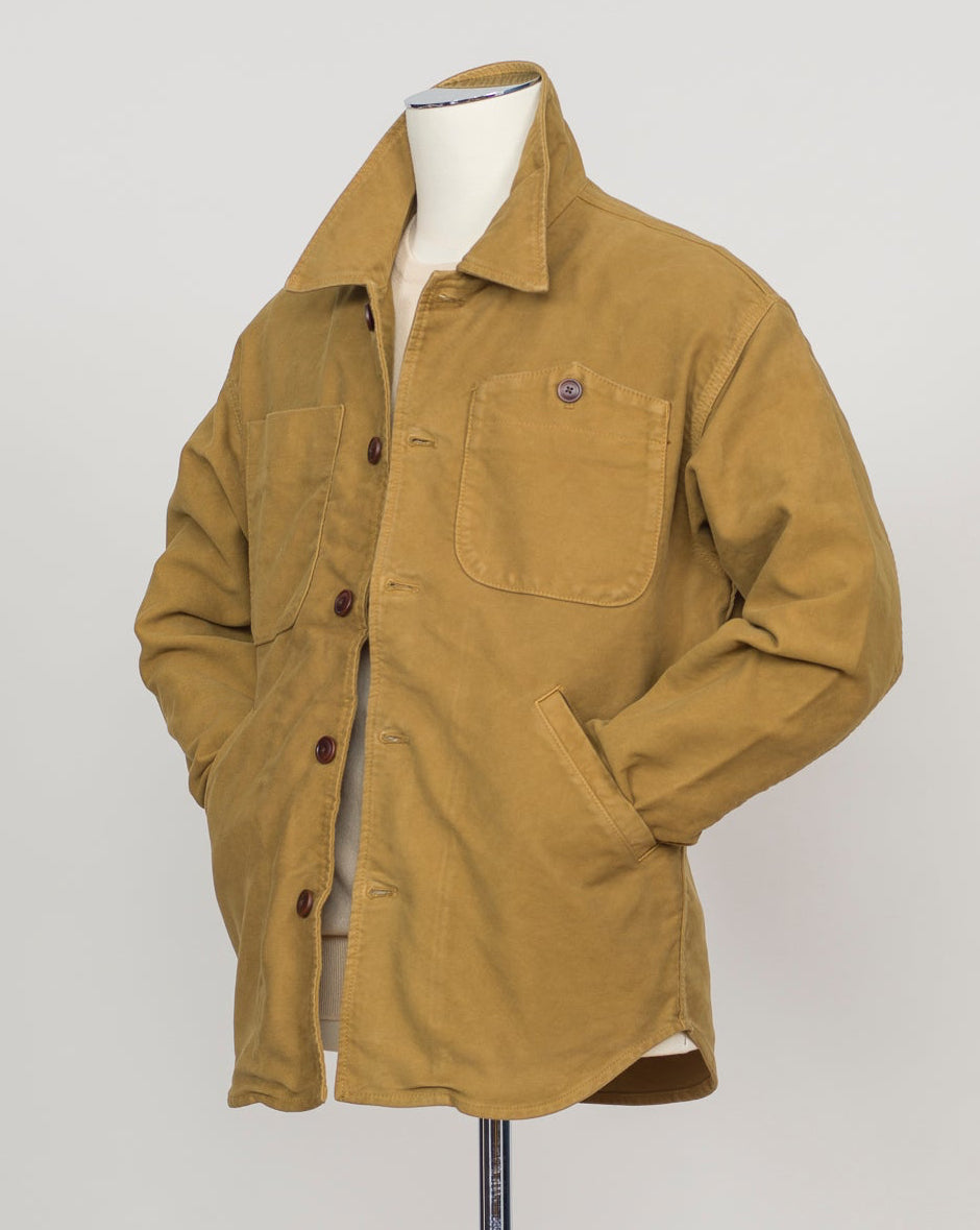 Structured overshirt tailored for layering over knitwear or worn standalone. Durable Italian moleskin fabric with subtle texture and natural drape. Versatile piece for refined casual and smart-casual wardrobes. Tela Genova Moleskin Overshirt / Mustard