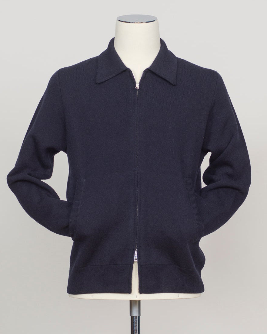 Knitted Full-Zip Bomber in navy. Premium Italian-made jacket that combines classic style with exceptional comfort. Crafted from a high-quality blend of 87% wool, 8% cashmere, and 5% polyamide, it offers a luxurious feel and excellent warmth. This versatile piece features a convenient full-zip front and a refined knitted texture, making it perfect for both smart-casual and relaxed everyday wear. FLY3 Knitted Full-Zip Bomber / Navy