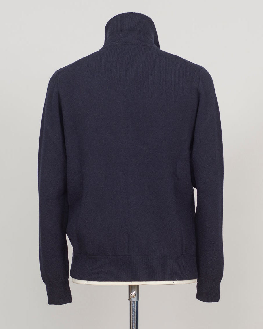 Knitted Full-Zip Bomber in navy. Premium Italian-made jacket that combines classic style with exceptional comfort. Crafted from a high-quality blend of 87% wool, 8% cashmere, and 5% polyamide, it offers a luxurious feel and excellent warmth. This versatile piece features a convenient full-zip front and a refined knitted texture, making it perfect for both smart-casual and relaxed everyday wear. FLY3 Knitted Full-Zip Bomber / Navy