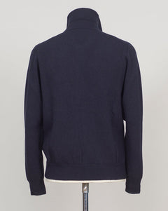 Knitted Full-Zip Bomber in navy. Premium Italian-made jacket that combines classic style with exceptional comfort. Crafted from a high-quality blend of 87% wool, 8% cashmere, and 5% polyamide, it offers a luxurious feel and excellent warmth. This versatile piece features a convenient full-zip front and a refined knitted texture, making it perfect for both smart-casual and relaxed everyday wear. FLY3 Knitted Full-Zip Bomber / Navy