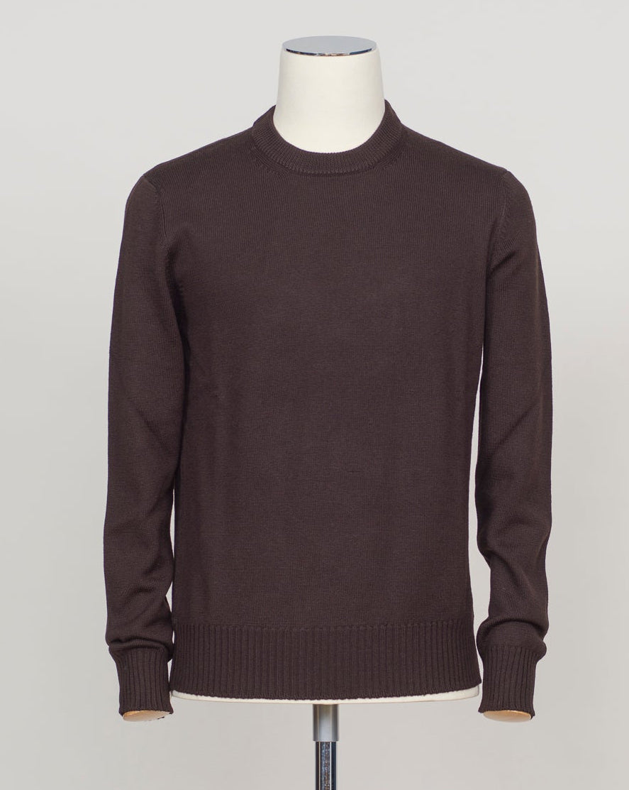 Heavyweight merino crewneck in rich dark brown. Luxurious Italian craftsmanship with the warmth and breathability of pure merino wool. A versatile layering piece that pairs effortlessly with tailored trousers or casual wear. Substantial knit construction ensures lasting comfort and shape retention through seasons of wear. Gran Sasso Heavy Merino Crewneck / Dark Brown