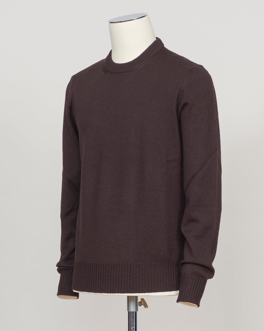 Heavyweight merino crewneck in rich dark brown. Luxurious Italian craftsmanship with the warmth and breathability of pure merino wool. A versatile layering piece that pairs effortlessly with tailored trousers or casual wear. Substantial knit construction ensures lasting comfort and shape retention through seasons of wear. Gran Sasso Heavy Merino Crewneck / Dark Brown