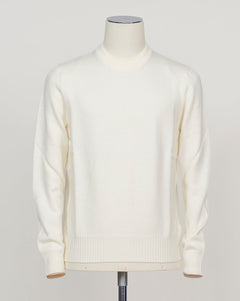 Substantial crewneck in heavy merino wool, masterfully constructed for enduring comfort. The luxurious fabric delivers warmth and breathability in equal measure, with a refined silhouette that pairs effortlessly with tailored trousers or casual wear. A timeless essential for discerning wardrobes. Gran Sasso Heavy Merino Crewneck / Off White
