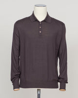 A refined three-ply knit polo crafted from a luxurious blend of merino wool, cashmere, and silk. The dark brown tone offers versatility across seasons, while the natural fiber composition ensures breathability and a subtle sheen. Designed for the discerning wearer who values both comfort and understated elegance. Gran Sasso Wool Cashmere &amp; Silk Polo / Dark Brown