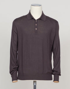 A refined three-ply knit polo crafted from a luxurious blend of merino wool, cashmere, and silk. The dark brown tone offers versatility across seasons, while the natural fiber composition ensures breathability and a subtle sheen. Designed for the discerning wearer who values both comfort and understated elegance. Gran Sasso Wool Cashmere &amp; Silk Polo / Dark Brown
